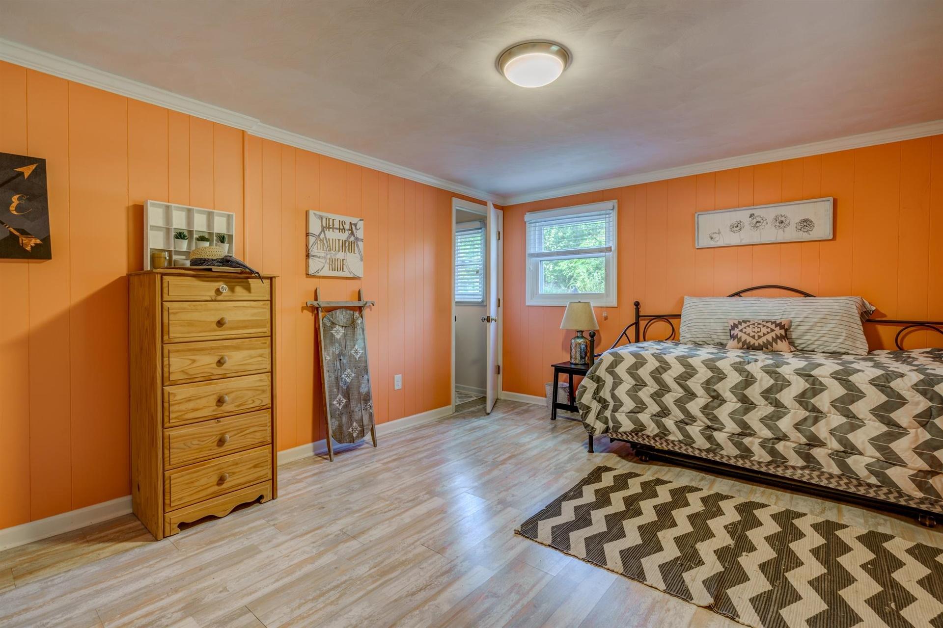 411 Monte Vista Road Union Hall, VA 24176 - Photo 28 of 45 a bedroom with a bed and wooden floor