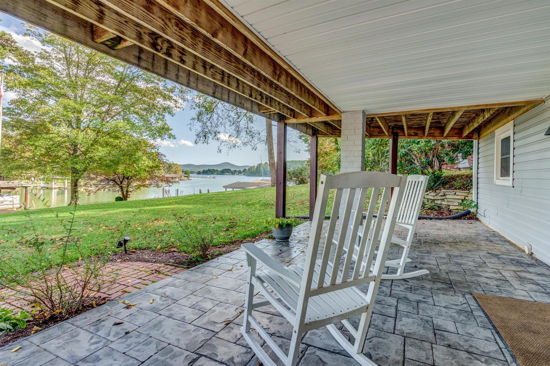 411 Monte Vista Road Union Hall, VA 24176 - Photo 30 of 45 a view of a chair and tables in the backyard