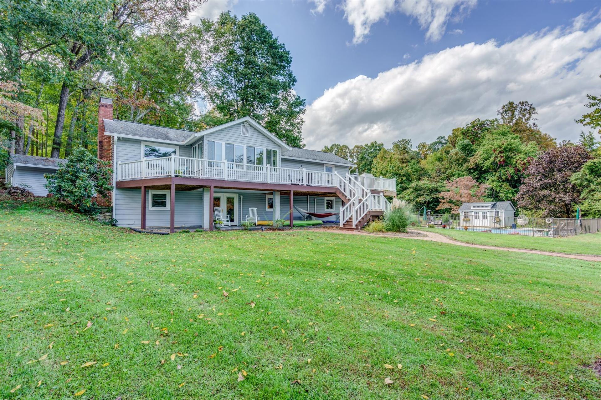 411 Monte Vista Road Union Hall, VA 24176 - Photo 36 of 45 a view of a house with a big yard and large trees