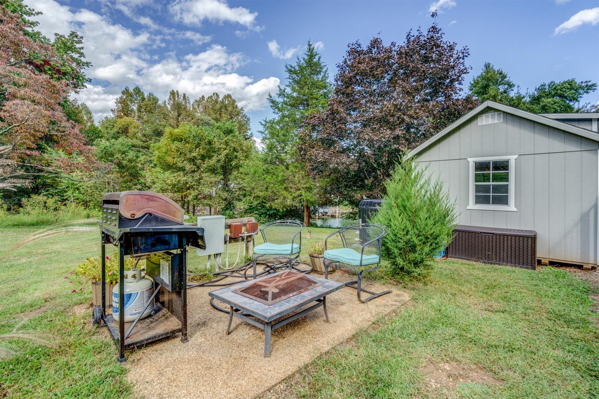 411 Monte Vista Road Union Hall, VA 24176 - Photo 41 of 45 a backyard of a house with yard barbeque oven and outdoor seating