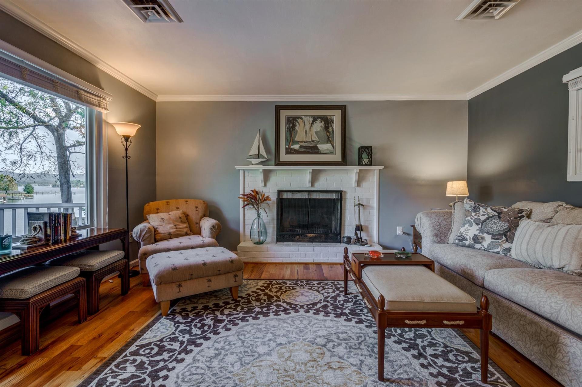 411 Monte Vista Road Union Hall, VA 24176 - Photo 6 of 45 a living room with furniture and a fireplace