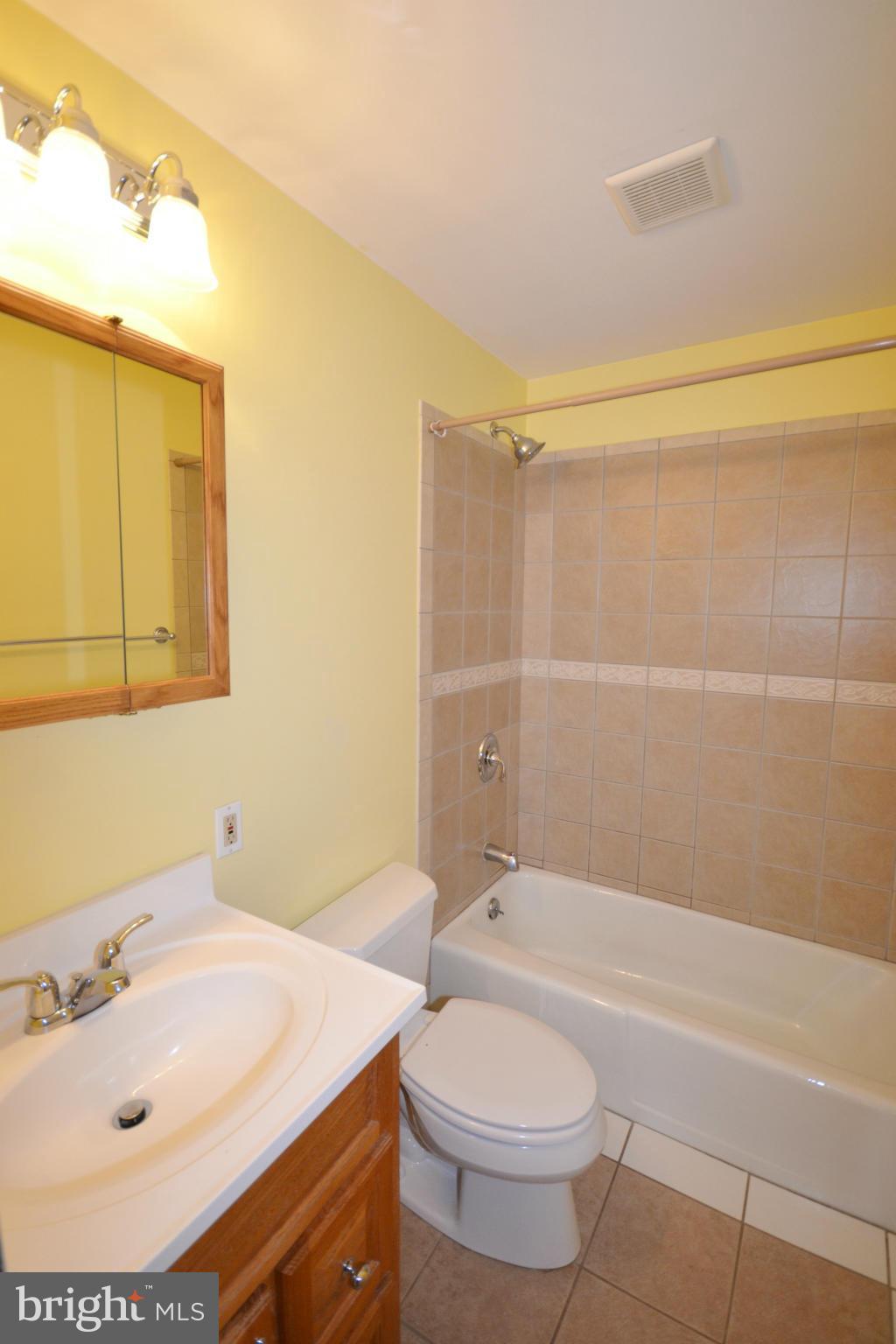 1031 Muller Road Westminster, MD 21157 - Photo 19 of 30 Ceramic tile floor and Surrounding shower in bath
