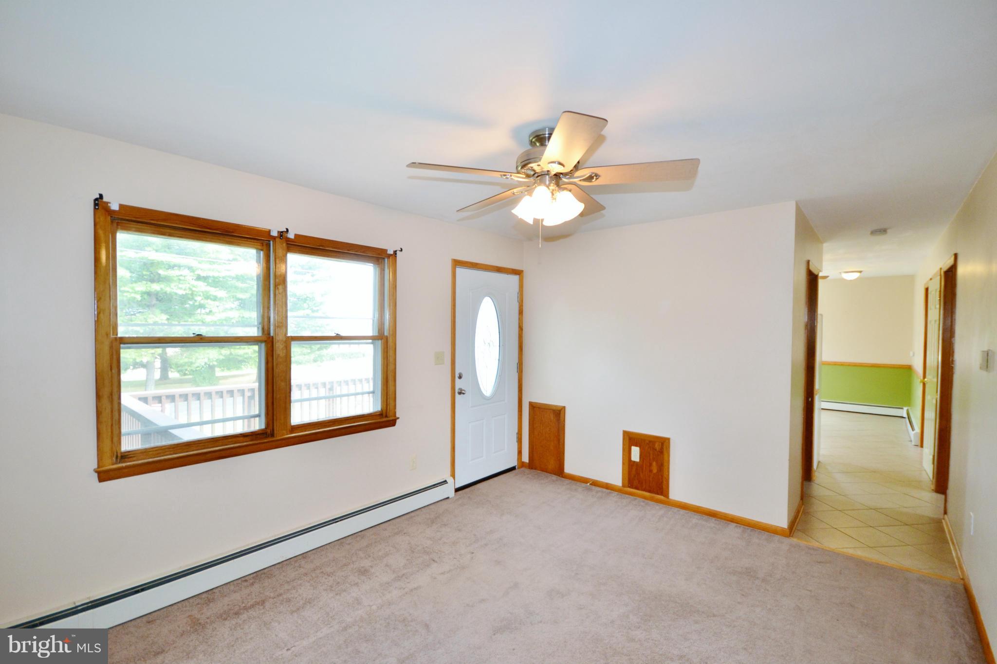 1031 Muller Road Westminster, MD 21157 - Photo 3 of 30 Hardwood floor under the carpet in Living Room