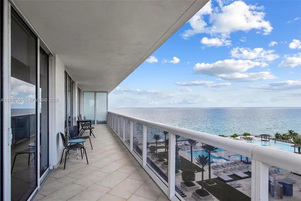 a view of balcony with furniture