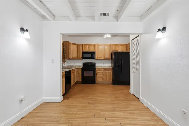 a kitchen with stainless steel appliances a refrigerator and a sink