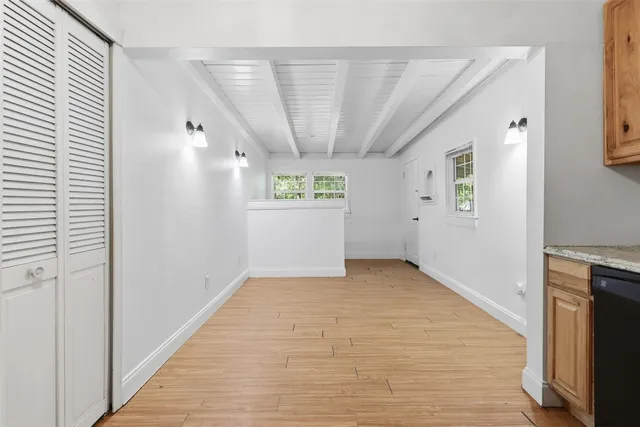 a view of an empty room with windows