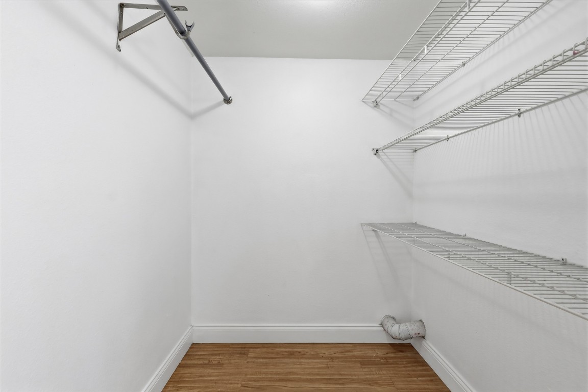 1215 Porter Street Taylor, TX 76574 - Photo 18 of 25 a view of a room with racks on the wall