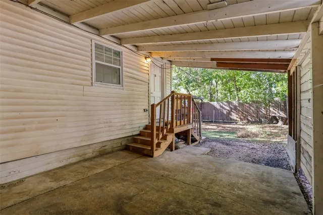 a view of a yard with a tree