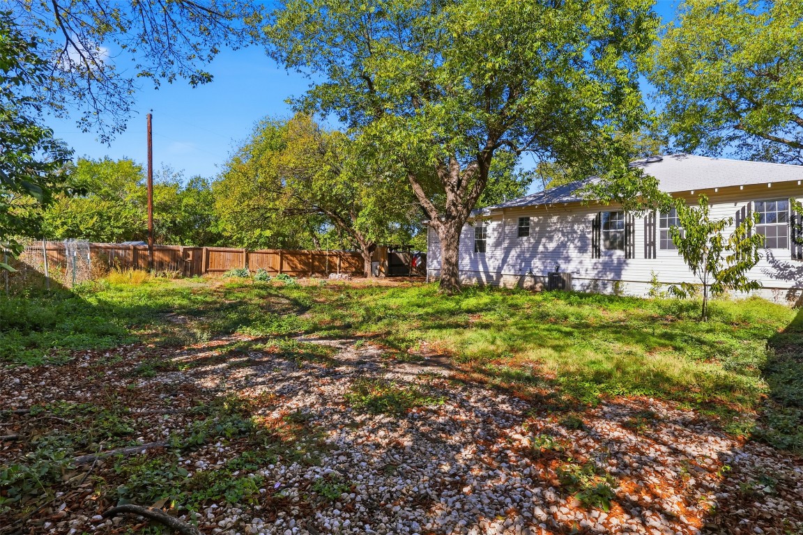 1215 Porter Street Taylor, TX 76574 - Photo 24 of 25 a view of a backyard with a garden