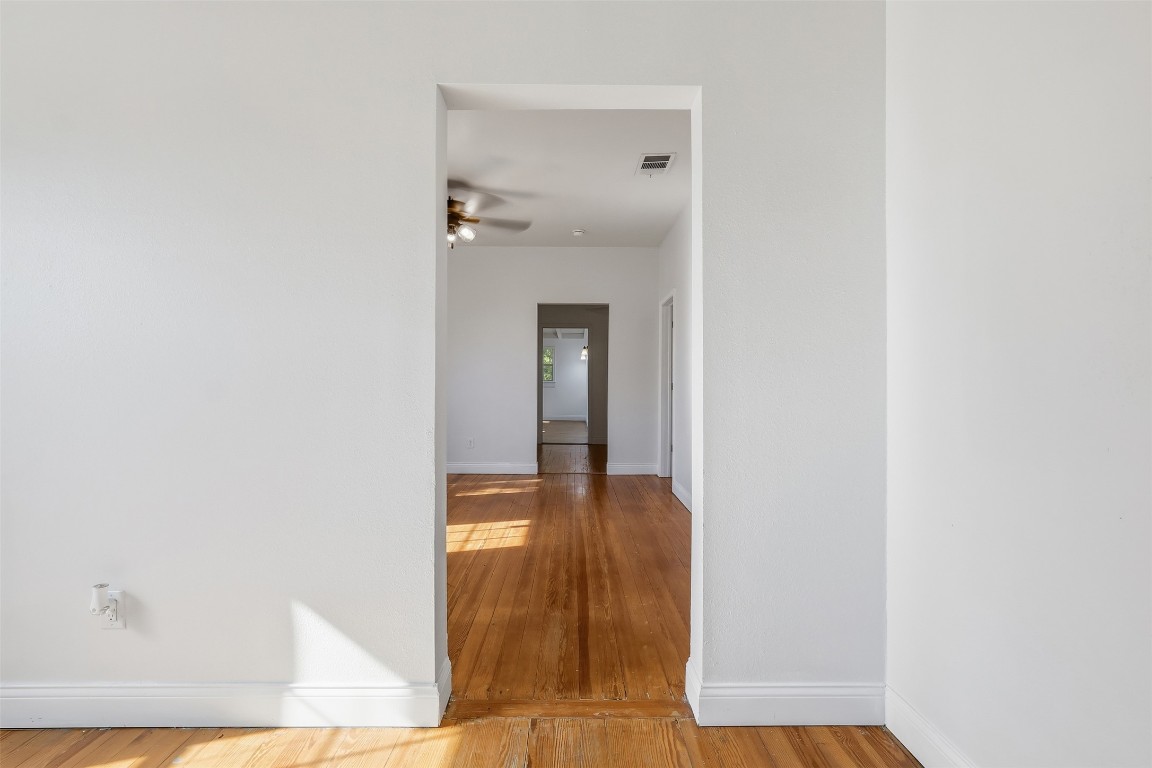 1215 Porter Street Taylor, TX 76574 - Photo 4 of 25 a view of a bathroom from a corridor