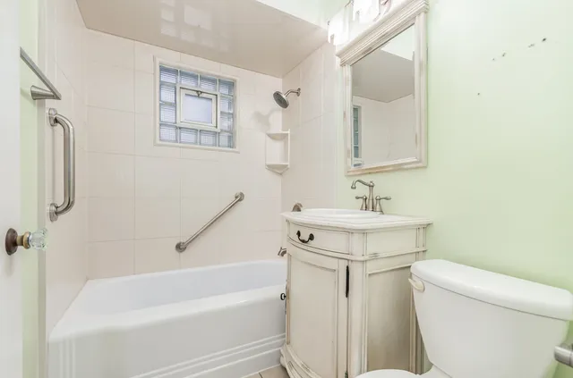 a bathroom with a sink toilet and bathtub