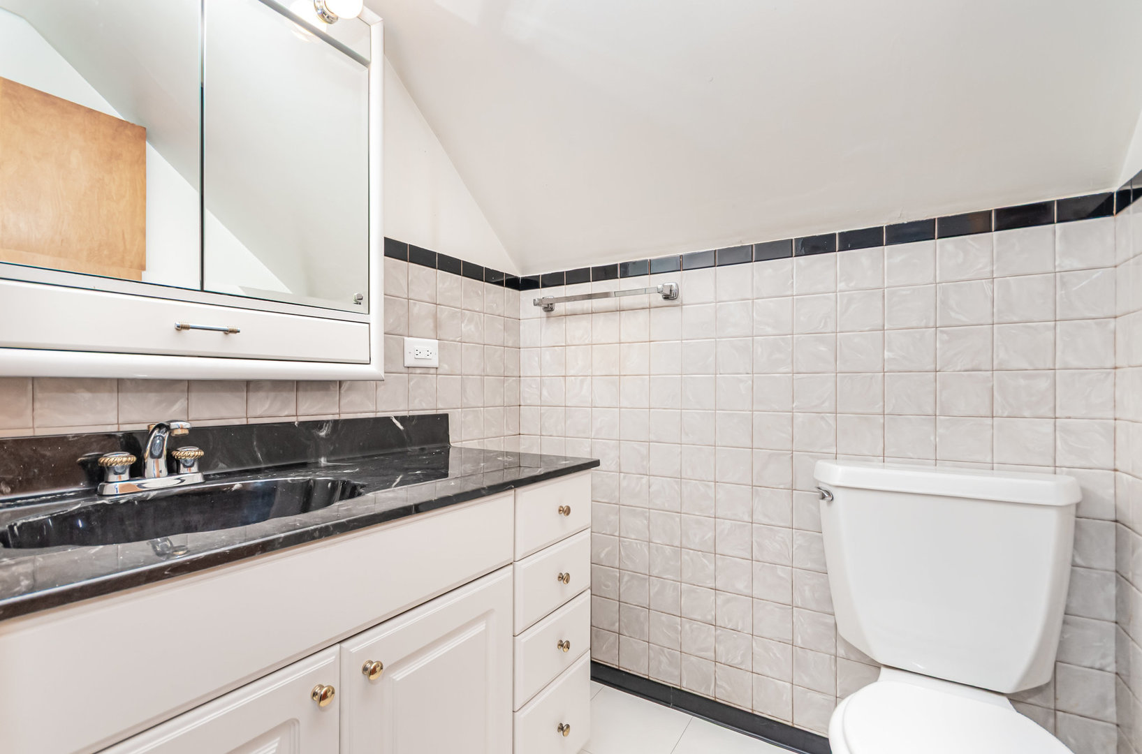 1924 Herbert Avenue Berkeley, IL 60163 - Photo 16 of 29 a bathroom with a granite countertop toilet sink and mirror