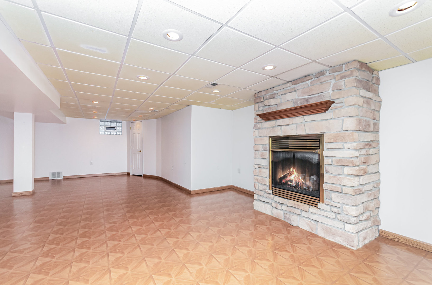 1924 Herbert Avenue Berkeley, IL 60163 - Photo 19 of 29 a view of an empty room with a fireplace