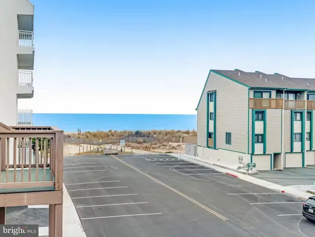 a view of a street with an ocean view