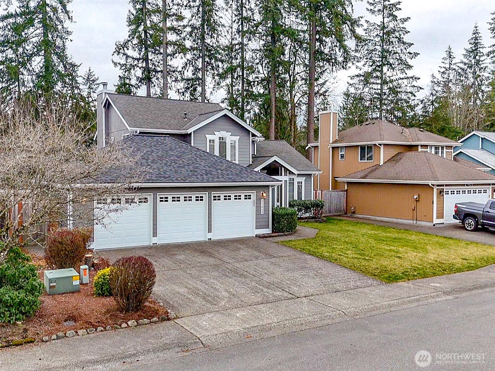 23425 Southeast 248th Street Maple Valley, WA 98038 - Photo 2 of 40 a front view of a house with garden