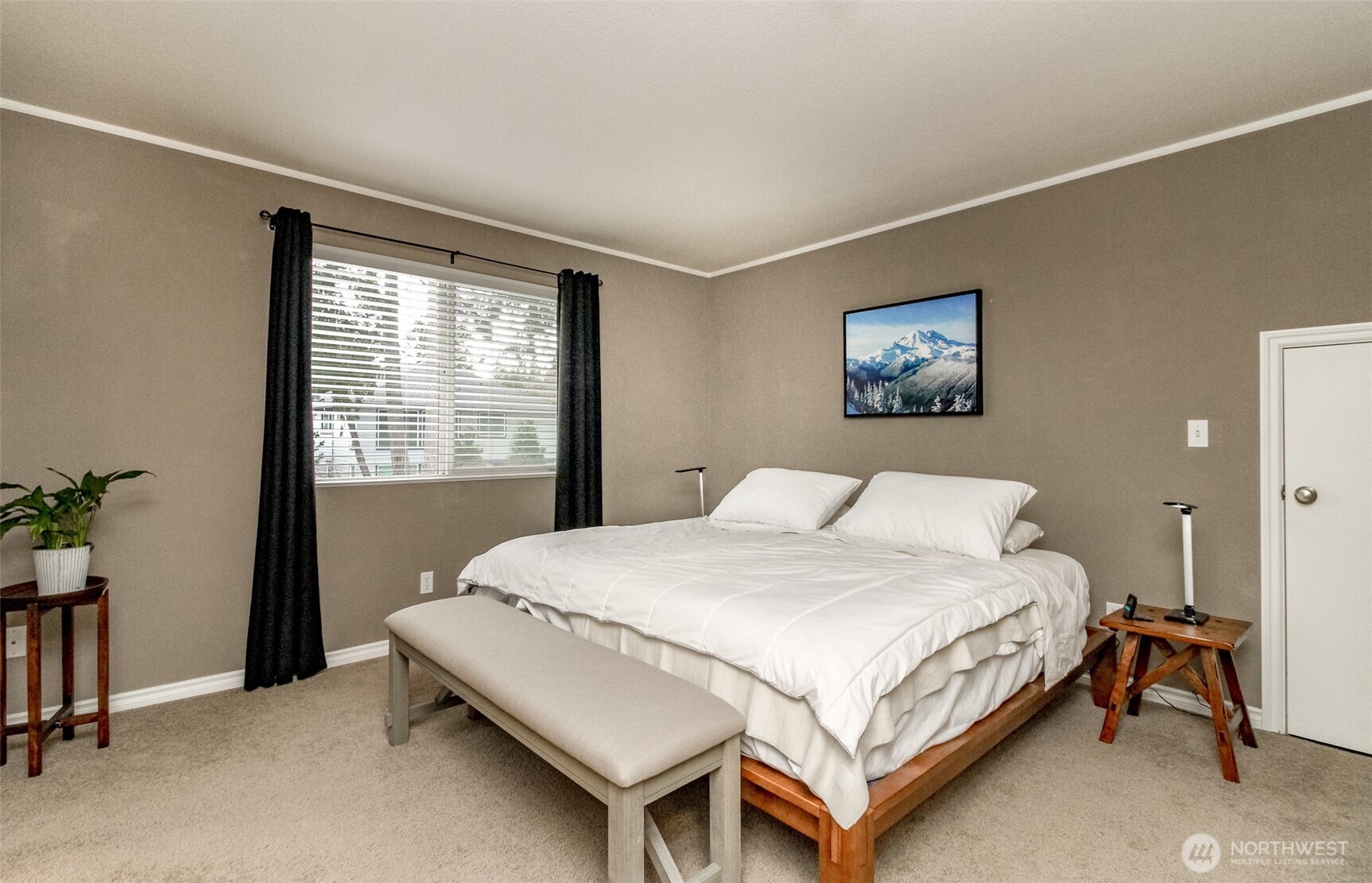 23425 Southeast 248th Street Maple Valley, WA 98038 - Photo 23 of 40 a bedroom with a bed table and a window