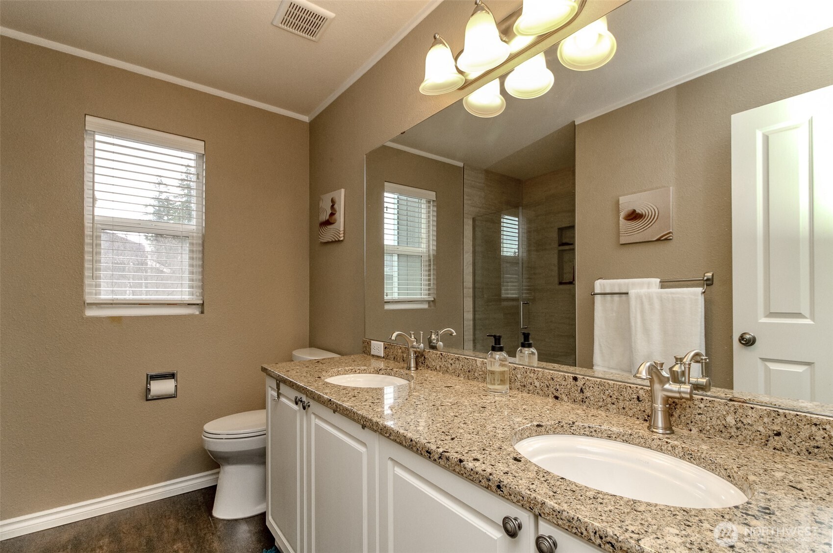 23425 Southeast 248th Street Maple Valley, WA 98038 - Photo 25 of 40 a bathroom with a granite countertop sink a toilet and a mirror
