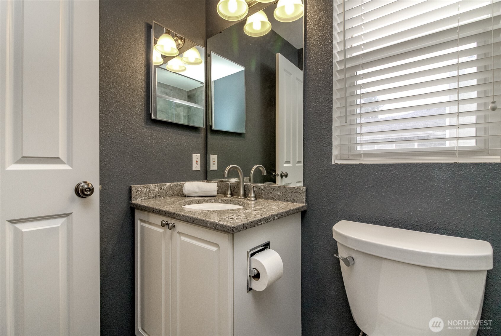 23425 Southeast 248th Street Maple Valley, WA 98038 - Photo 28 of 40 a bathroom with a toilet sink and mirror
