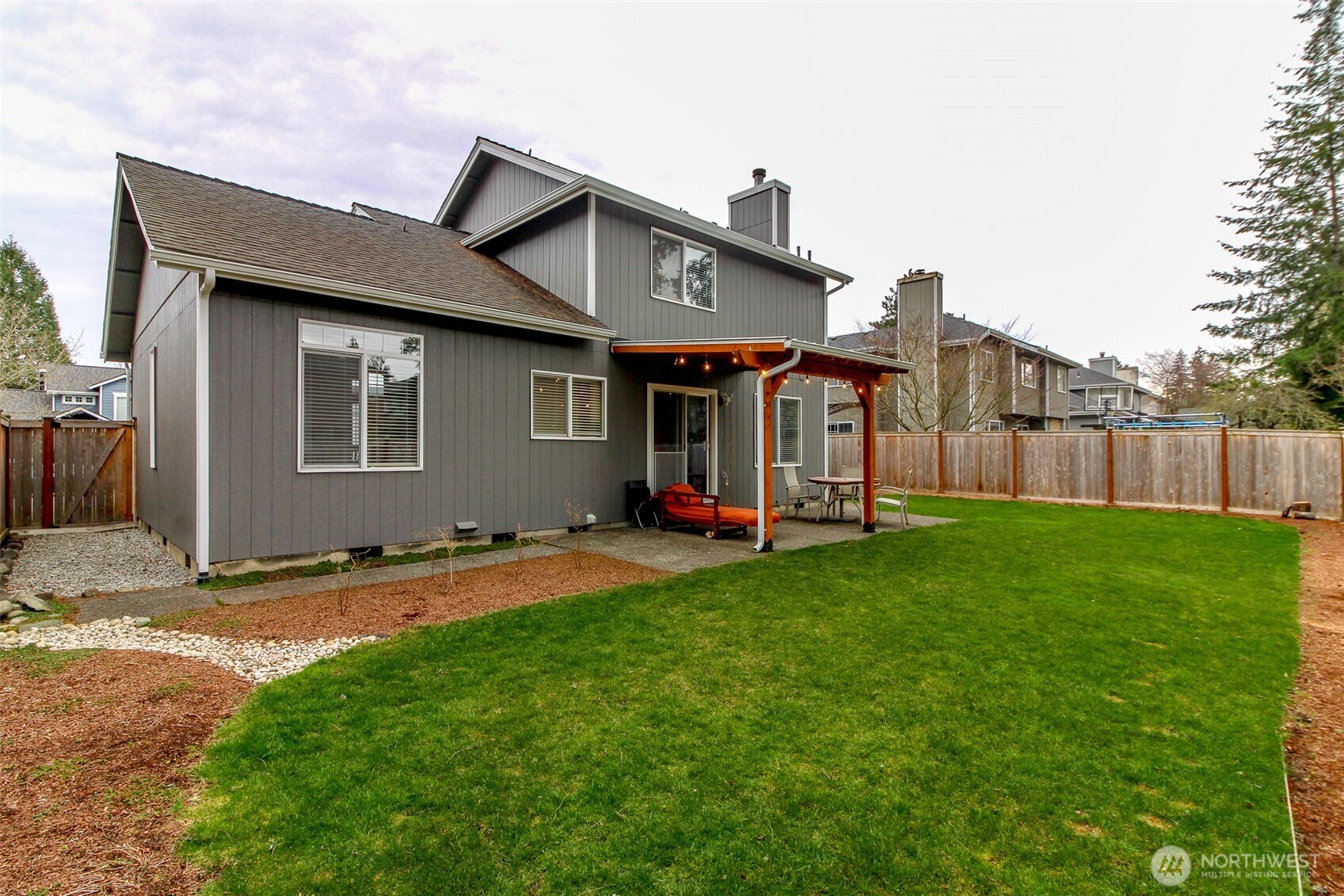 23425 Southeast 248th Street Maple Valley, WA 98038 - Photo 32 of 40 a front view of a house with a yard and garage
