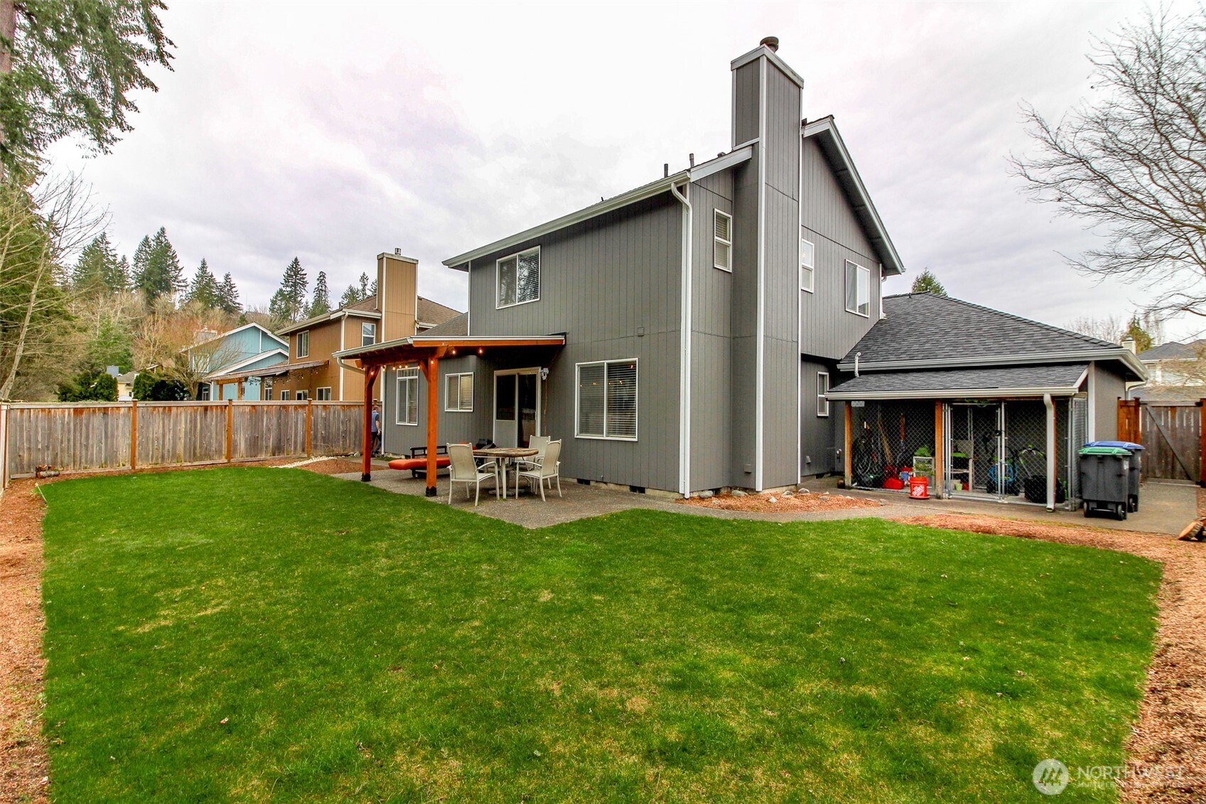 23425 Southeast 248th Street Maple Valley, WA 98038 - Photo 33 of 40 a view of a house with patio and a yard
