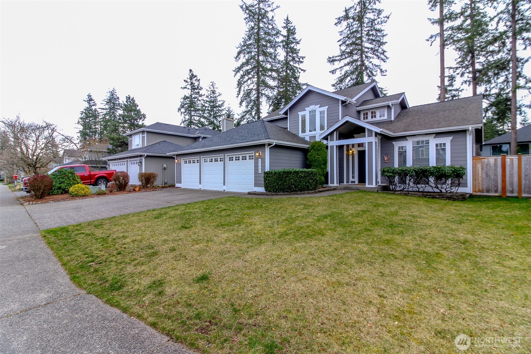 23425 Southeast 248th Street Maple Valley, WA 98038 - Photo 36 of 40 a front view of a house with garden