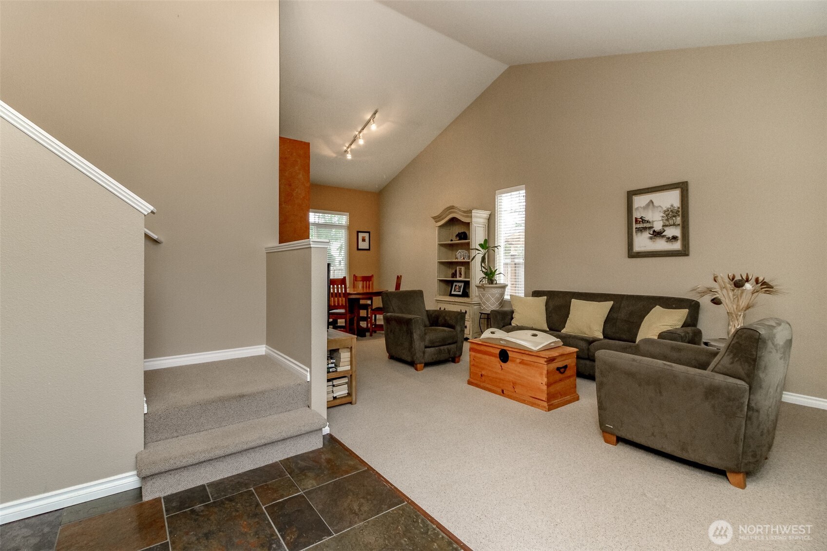 23425 Southeast 248th Street Maple Valley, WA 98038 - Photo 4 of 40 a living room with furniture a couch and a window