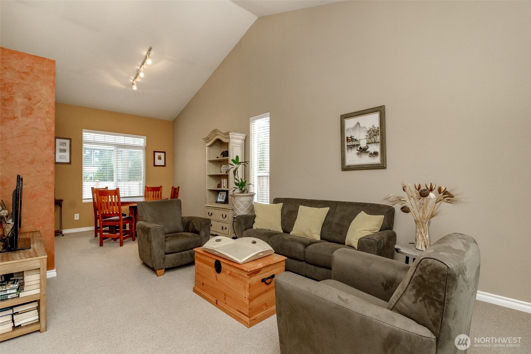 23425 Southeast 248th Street Maple Valley, WA 98038 - Photo 5 of 40 a living room with furniture and a flat screen tv