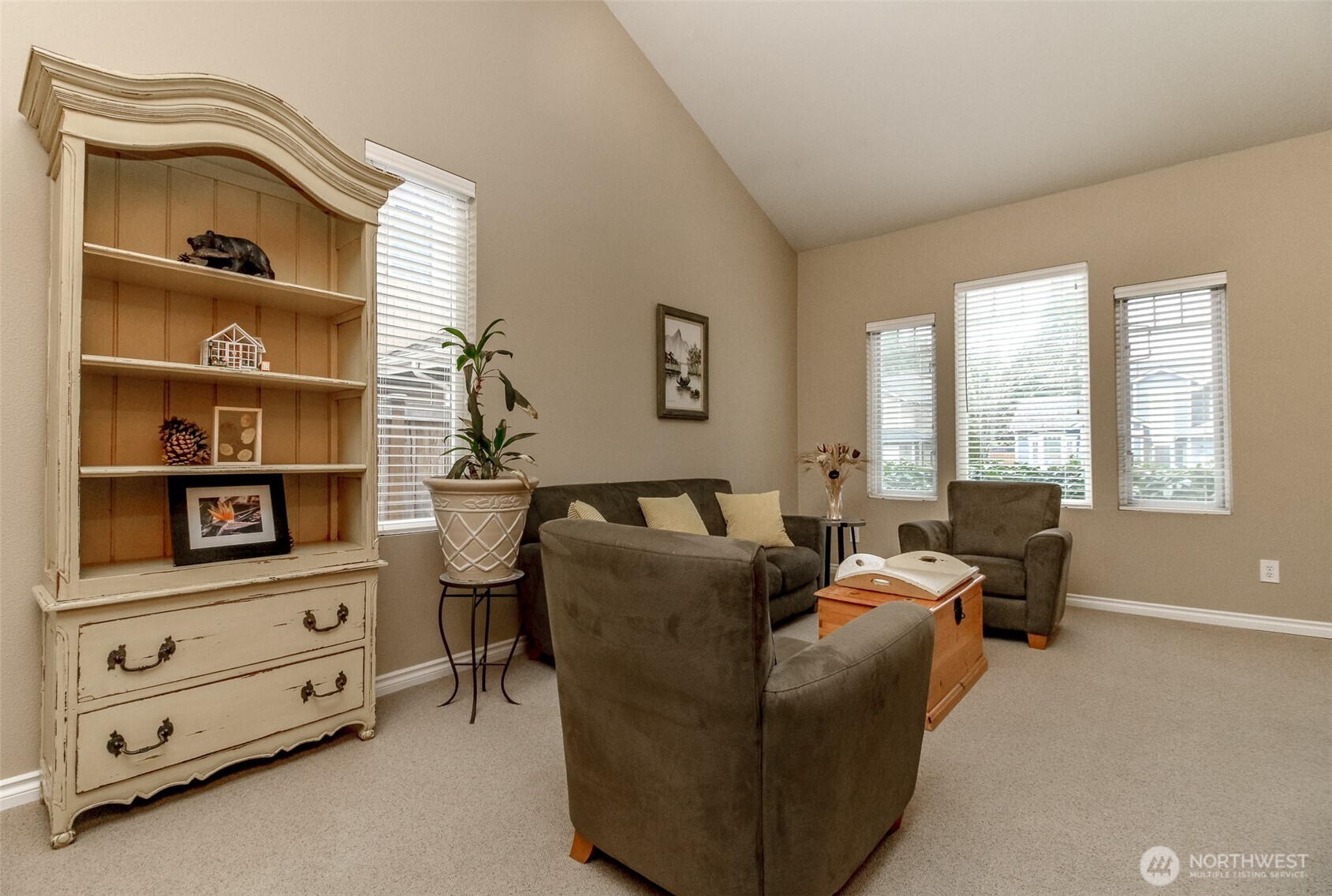 23425 Southeast 248th Street Maple Valley, WA 98038 - Photo 6 of 40 a living room with furniture cabinets and window
