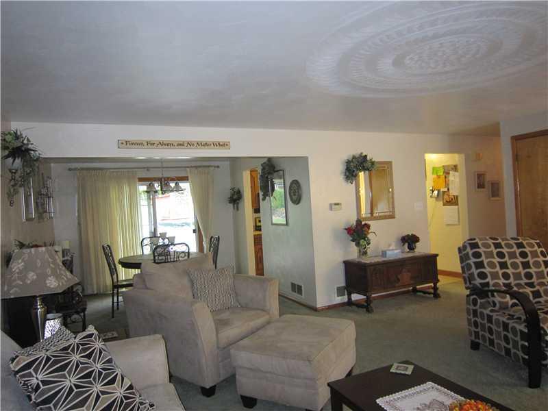 11520 Drop Road North Huntingdon, PA 15642 - Photo 8 of 25 Living Room. Large living room open to dining room with patio doors leading to patio