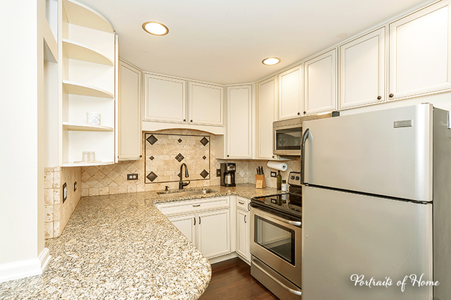 1900 Light Road, Unit 102 Oswego, IL 60543 - Photo 2 of 10 a kitchen with a sink appliances and cabinets