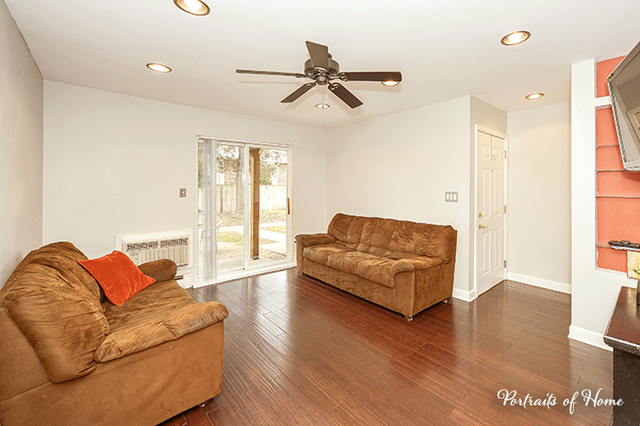 1900 Light Road, Unit 102 Oswego, IL 60543 - Photo 7 of 10 a living room with furniture and a large window