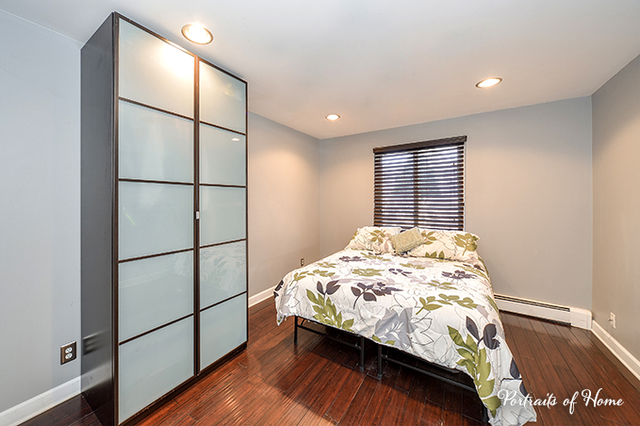 1900 Light Road, Unit 102 Oswego, IL 60543 - Photo 8 of 10 a bedroom with a bed and a window