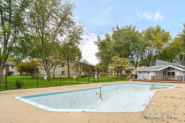 1900 Light Road, Unit 102 Oswego, IL 60543 - Photo 10 of 10 a view of a house with a backyard