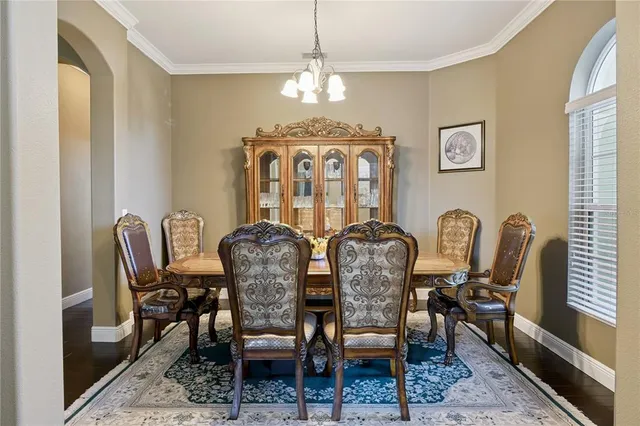 a dining room with furniture and window