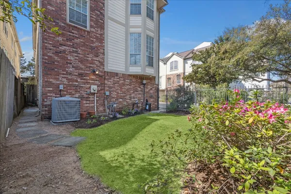 a view of a house with a garden and pathway