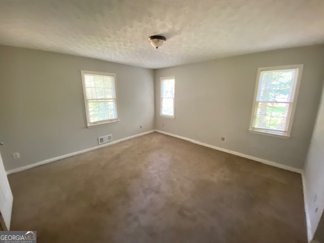 203 Farmbrook Parkway Stockbridge, GA 30281 - Photo 12 of 25 a view of an empty room with a window