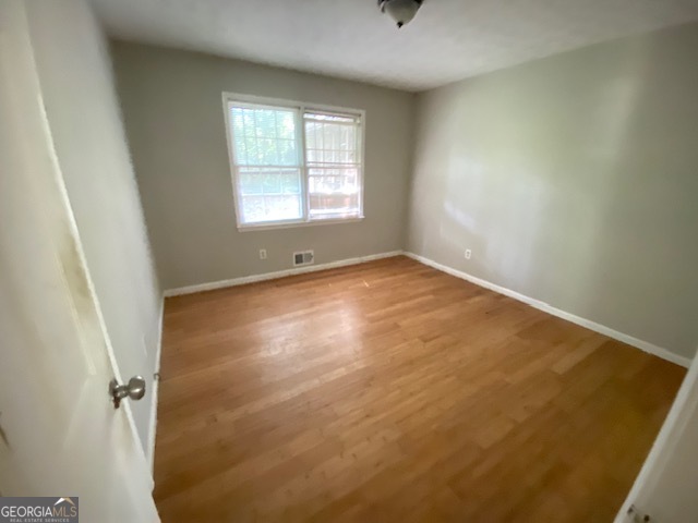 203 Farmbrook Parkway Stockbridge, GA 30281 - Photo 18 of 25 an empty room with windows