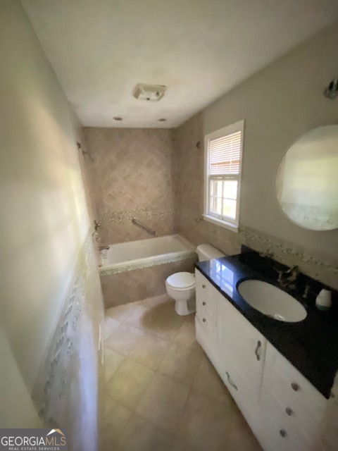 203 Farmbrook Parkway Stockbridge, GA 30281 - Photo 20 of 25 a bathroom with a granite countertop sink mirror vanity and toilet