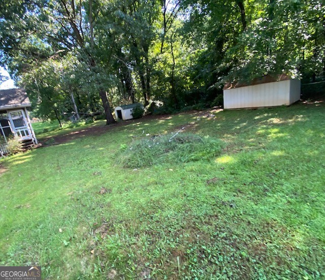 203 Farmbrook Parkway Stockbridge, GA 30281 - Photo 21 of 25 a view of a backyard with a white house