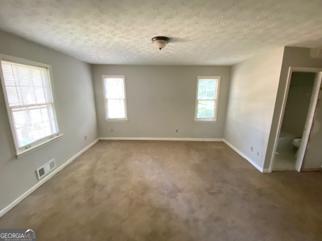 203 Farmbrook Parkway Stockbridge, GA 30281 - Photo 9 of 25 an empty room with windows