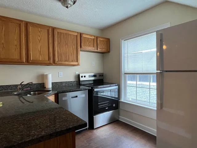 a kitchen that has a sink and a stove