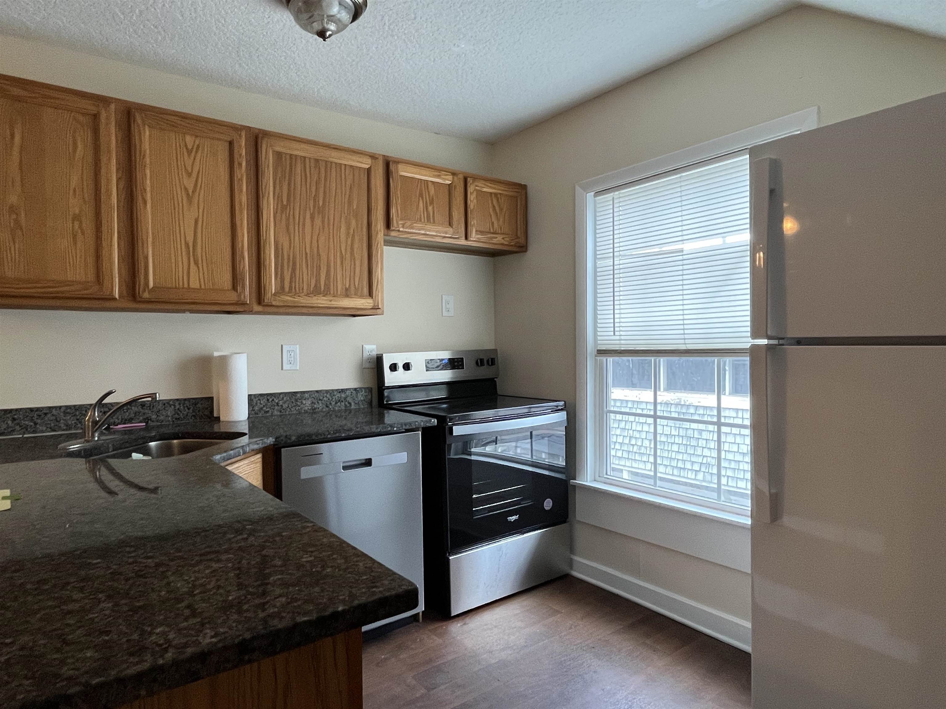 138 King Street, Unit C St. Augustine, FL 32084 - Photo 3 of 17 a kitchen that has a sink and a stove