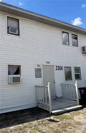 a front view of a house with stairs