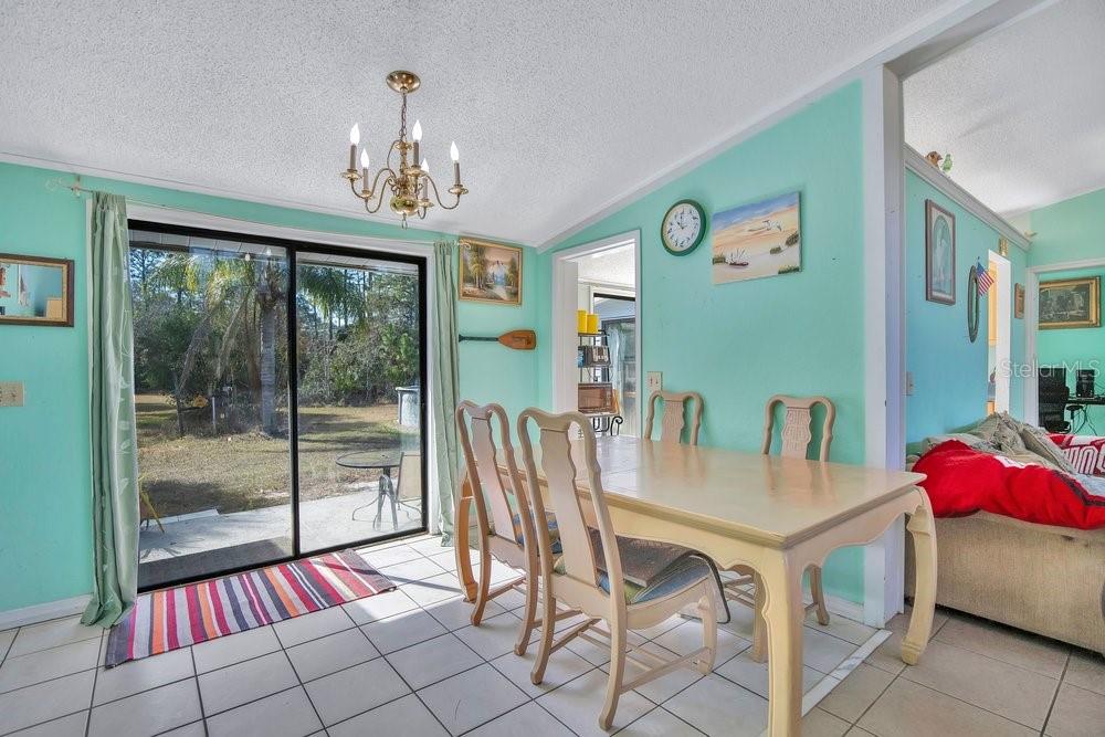 425 Scooter Point Geneva, FL 32732 - Photo 11 of 41 a dining room with furniture and window