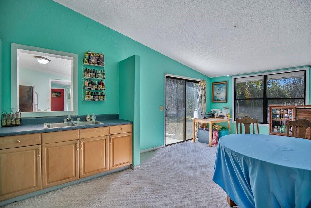425 Scooter Point Geneva, FL 32732 - Photo 17 of 41 a view of a kitchen area with furniture and window