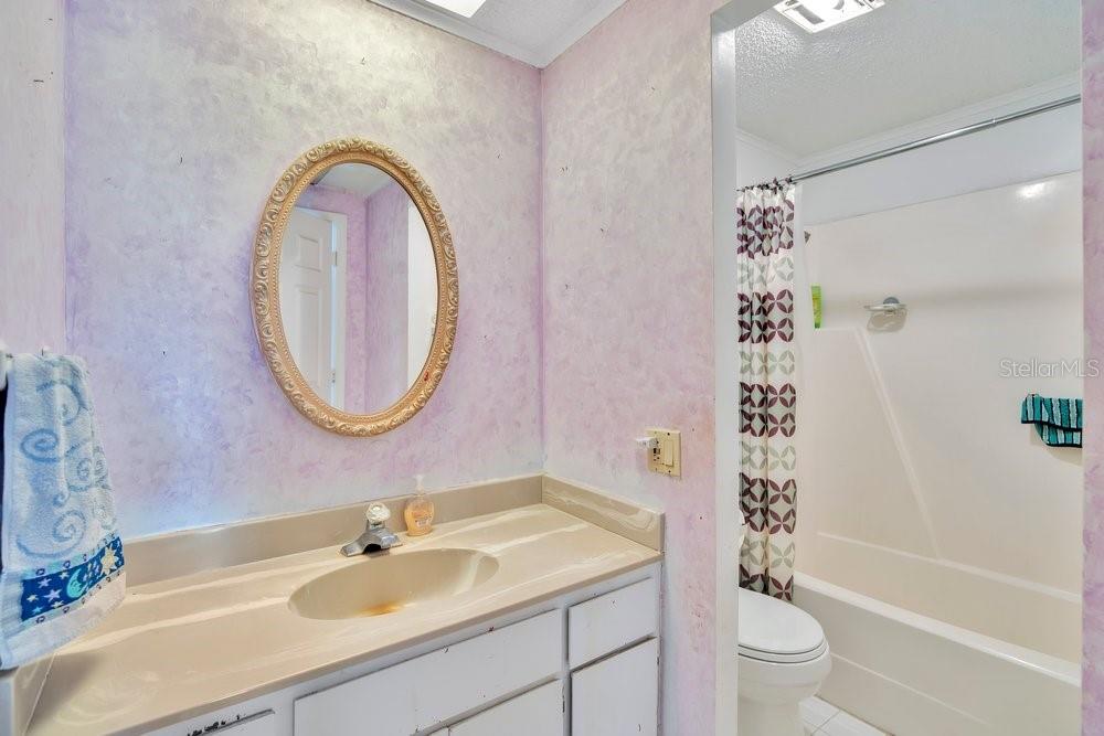 425 Scooter Point Geneva, FL 32732 - Photo 23 of 41 a bathroom with a sink toilet and shower