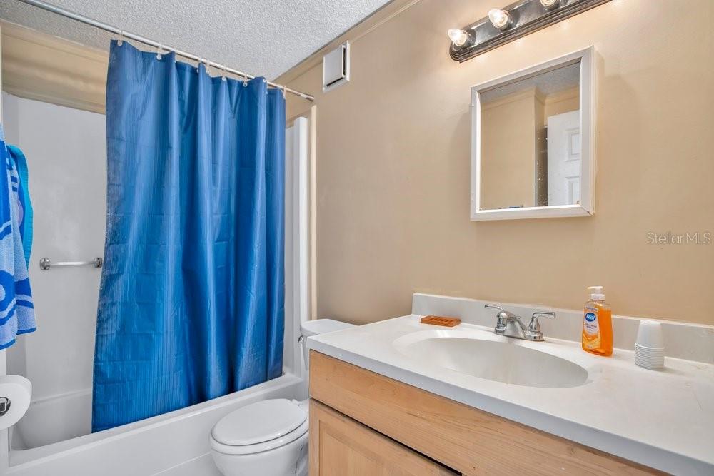 425 Scooter Point Geneva, FL 32732 - Photo 25 of 41 a bathroom with a sink a toilet and shower