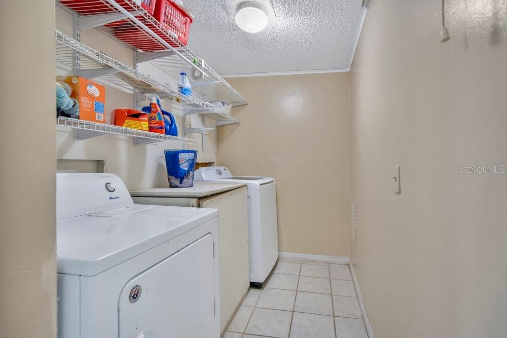 425 Scooter Point Geneva, FL 32732 - Photo 26 of 41 a storage room with washer and dryer