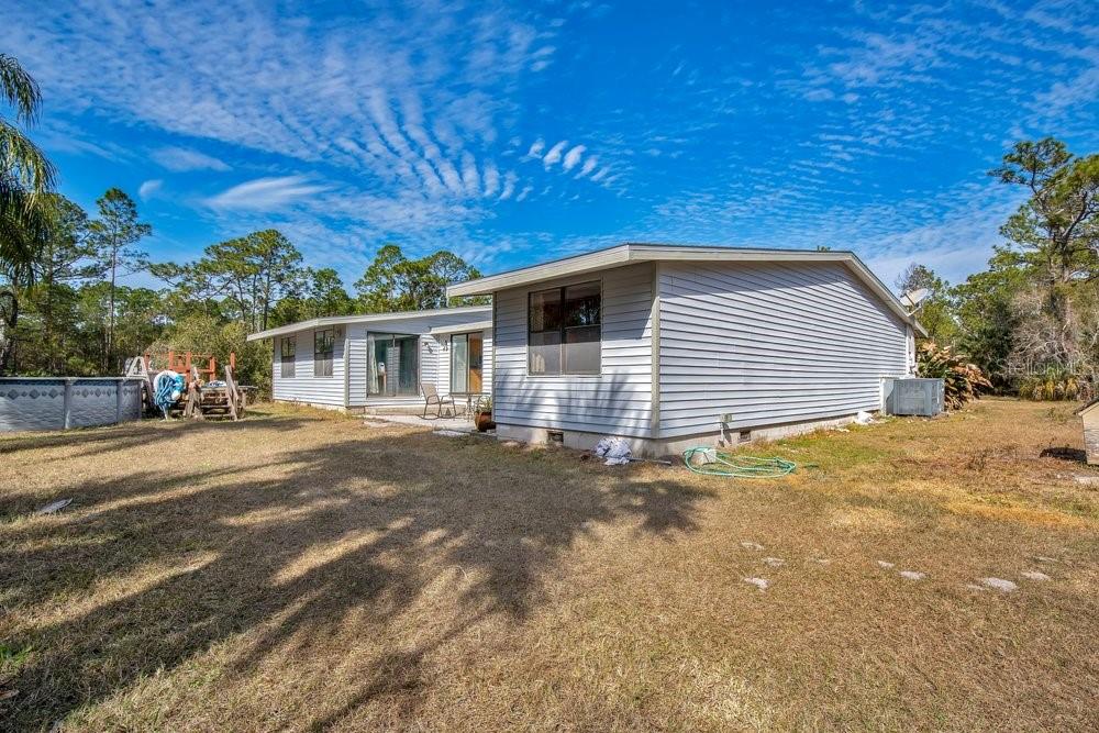 425 Scooter Point Geneva, FL 32732 - Photo 29 of 41 a front view of a house with a yard