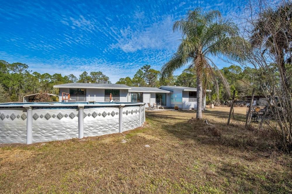 425 Scooter Point Geneva, FL 32732 - Photo 30 of 41 front view of house with a yard